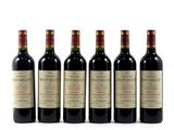 six bottles of wine are lined up on a white surface