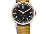 une image représentant une montre-bracelet avec un cadran noir et un bracelet beige clair
