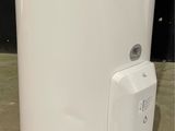 a water heater sitting on the floor in a room