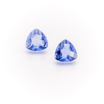 a pair of tanzane blue sapphires on a white background