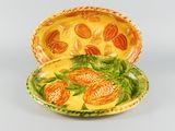 a yellow plate with a yellow and orange design on it