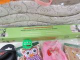 a box with a pair of scissors, a pair of socks, a pair of scissors, a pair of scissors, and a pair of scissors