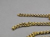 a gold chain that has been placed on a table