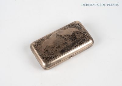 a silver cigarette case with a picture of a woman on it