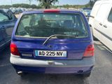a blue car parked in a parking lot with other cars