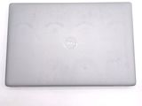 dell laptop computer sitting on a white surface with a white background