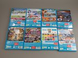 a lot of nintendo wii games on the table
