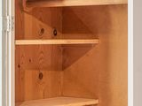 a white cupboard with shelves and a door open