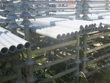 a lot of pipes that are sitting in the grass