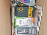 a cardboard box filled with electronic devices and other items