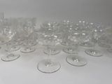 a lot of wine glasses sitting on a table
