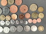 a lot of coins that are on the table