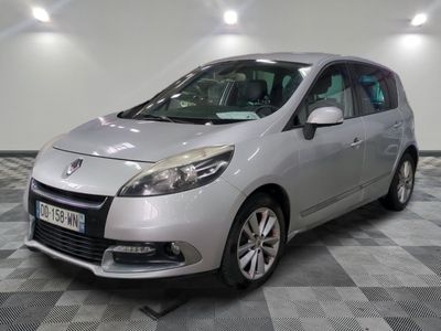 a picture of a silver car parked in a showroom