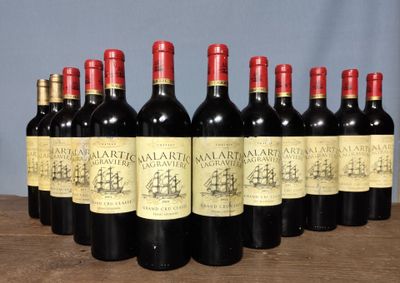 several bottles of wine are lined up on a table