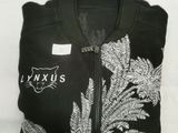 black and white t - shirt with a fern design on the front