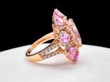 an image of a pink and white diamond ring on a white plate