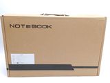 a box with a note book inside of it on a white surface