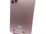 the back of a pink phone with a camera attached to it