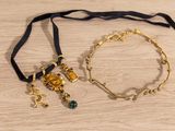 two bracelets that are sitting on a table