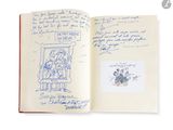 un livre ouvert sur lequel figure le dessin d'un homme assis sur une chaise
