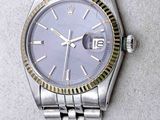 an image of a wrist watch with a purple dial on it