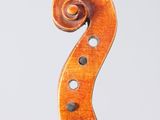 a close up of a violin with a wooden bow on a white background