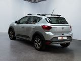 the rear of a silver car in a white room