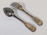 pair of silverware spoons and fork on a white surface