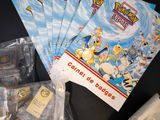 a bunch of pokemon cards and a bag of bags