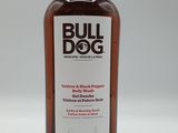 the front of a bottle of bull dog hand wash on a white background