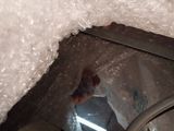 a picture of a person standing in a hole in a building