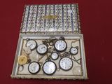 a box that has a bunch of clocks inside of it