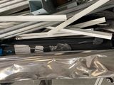 a pile of assorted metal items sitting on the floor