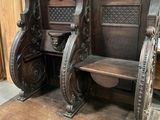 two wooden chairs that are on display in a store