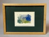 painting of a blue and green landscape in a wooden frame