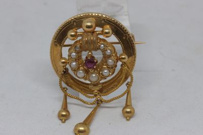 an image of a close up of a broochle on a white surface