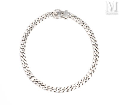 a silver chain bracelet with a clasp on a white background