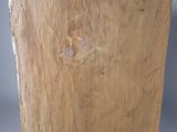 a piece of wood that is sitting on a stand
