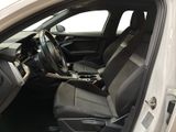 the interior of a white car with black seats and a steering wheel