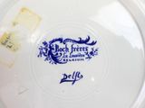 a plate with a blue and white design on it