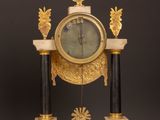 a clock that is sitting on top of a table