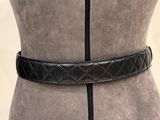 a close up of a mannequin torso with a black belt