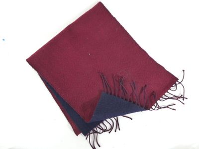 a red and blue scarf on a white surface