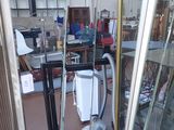 an image of a room with a vacuum and a glass door