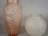 two vases sitting next to each other on a table