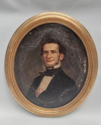 portrait of a man in a suit and bow tie in a gold frame