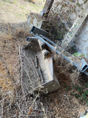 a piece of machinery that is laying on the ground