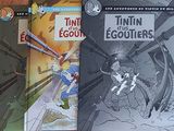 trois livres posés sur une table