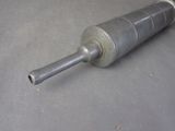 a metal pipe that has been placed on a table