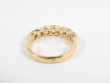an 18k yellow gold ring with diamonds